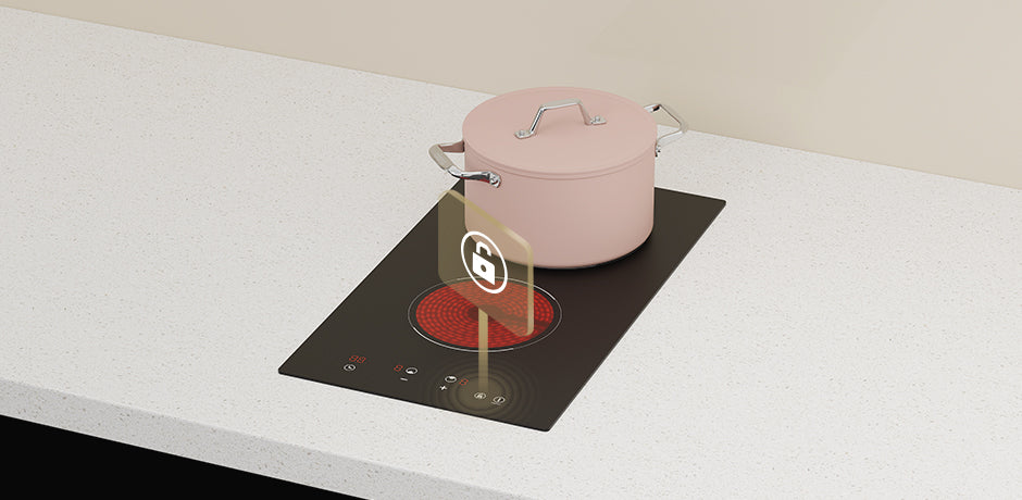 Pink pot on a modern electric stove with a neutral background