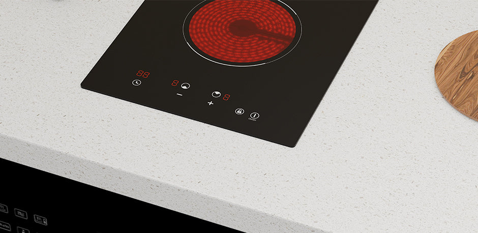 ceramic cooktop with a red heating element on a white countertop