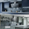 Ciarra 90cm angled glass cooker hood in a side-by-side lifestyle setup, demonstrating its modern minimalist design.